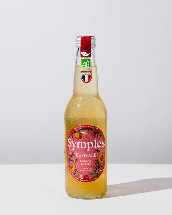 Symples infusion estivale in a glass bottle, featuring refreshing flavors of rosemary, citrus, and peach.